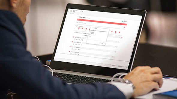 A laptop with the MAESTRO 11 software displays a patient’s configuration backup history.