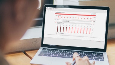 A laptop displays a screen in the MAESTRO 11 software where clinicians can complete a standard cochlear implant fitting procedure.