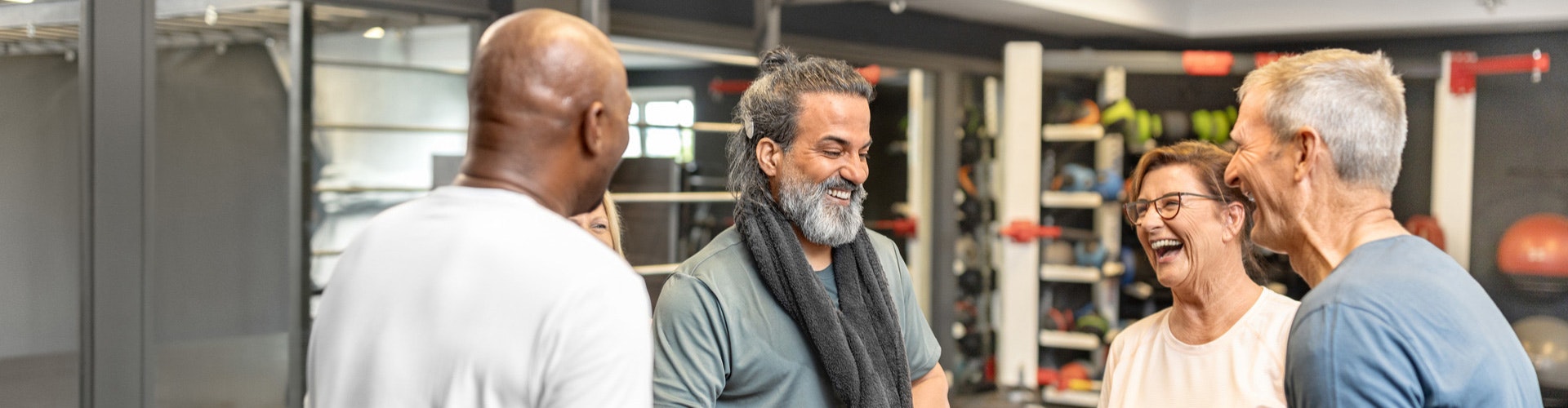 RONDO 3 user at the gym chatting with friends.