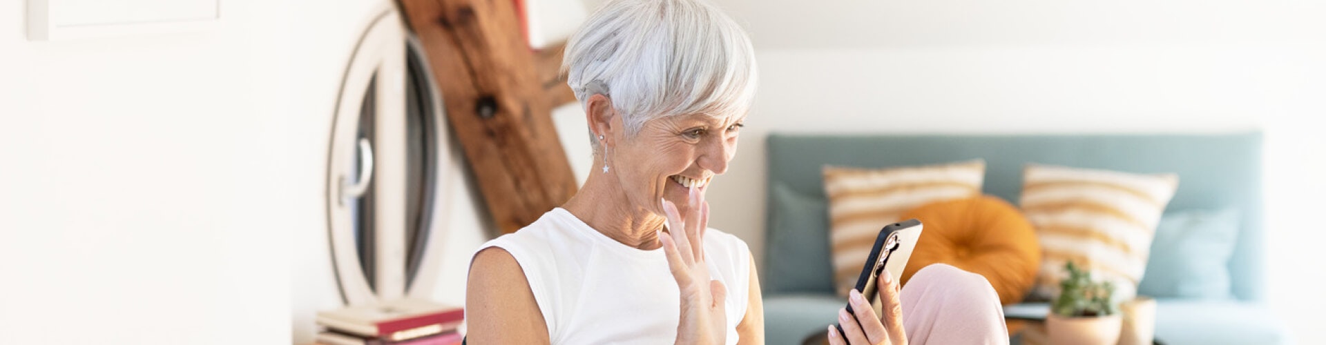 grandmother videochatting with her grandchildren while streaming the sound from the call directly to her SONNET 3