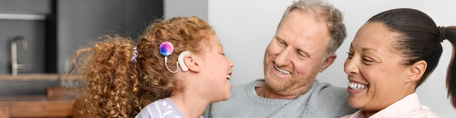 Family interaction featuring a child with a cochlear implant.