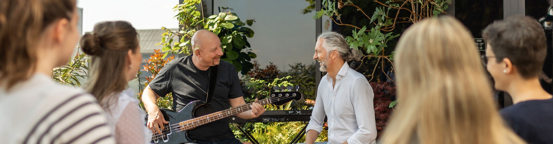 Upgrade Journey SONNET 3 user plays the bass guitar for a delighted audience.