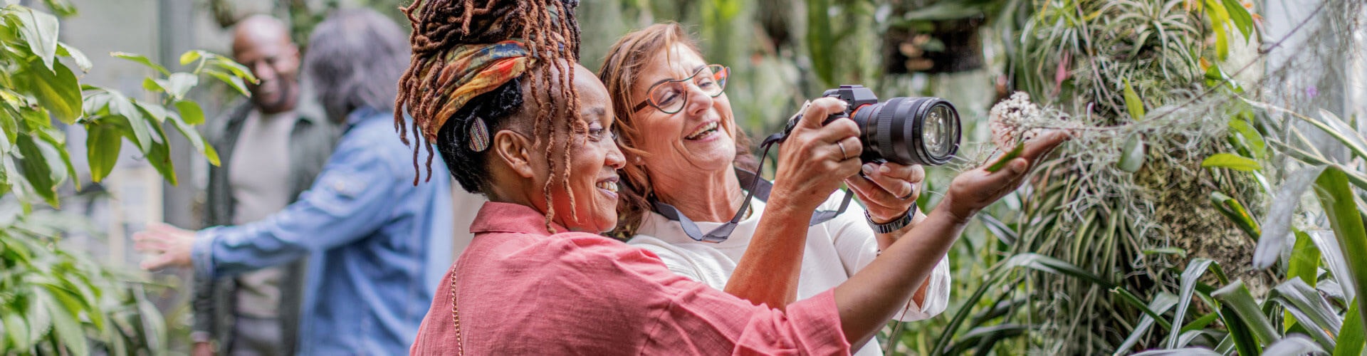 A New Way to Hear Cochlear implant user can hear and chat with her friend as they take photos together.